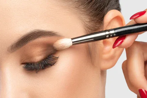 Applying eyeshadow, close-up